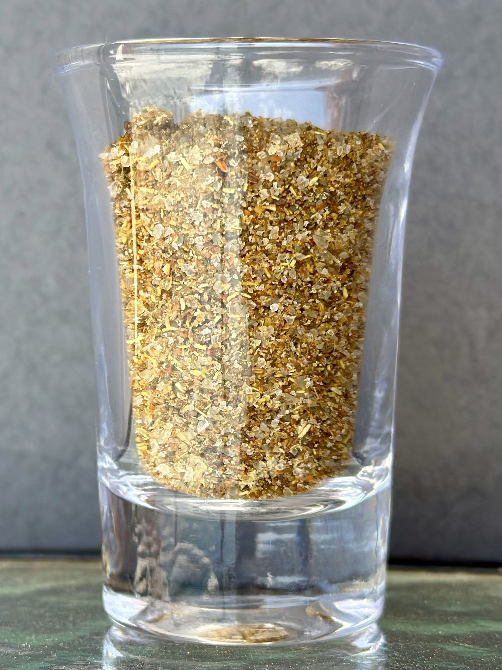 Svan salt, coarse salt ground with garlic and spices, in a small glass