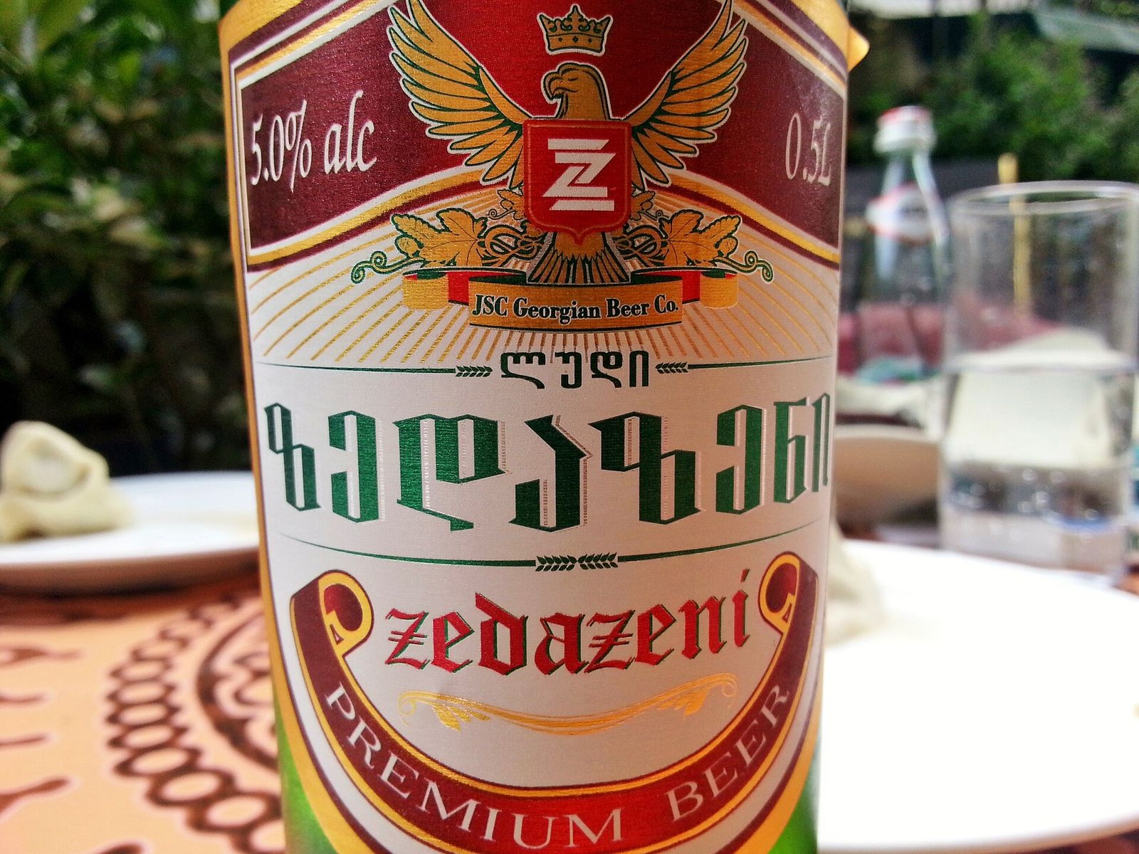A bottle of Zedazeni premium lager, a mainstream Georgian beer, on a restaurant table