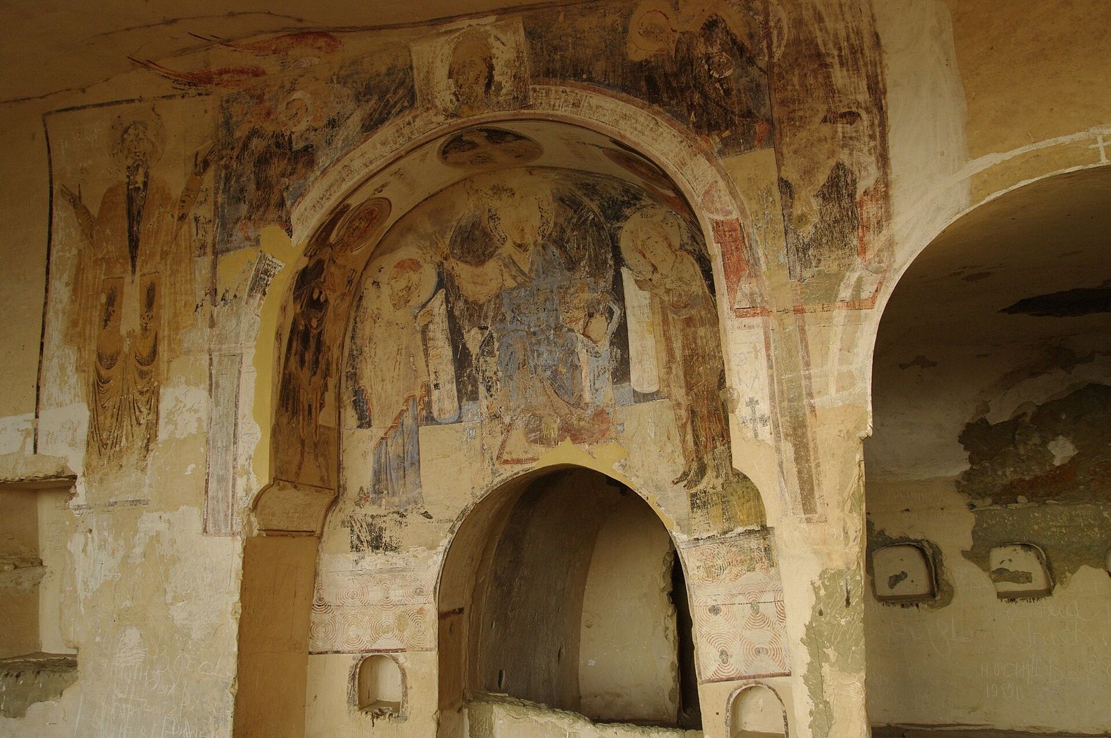 Medieval frescoes covering the walls and arches of a cave church at Udabno Monastery, David Gareja