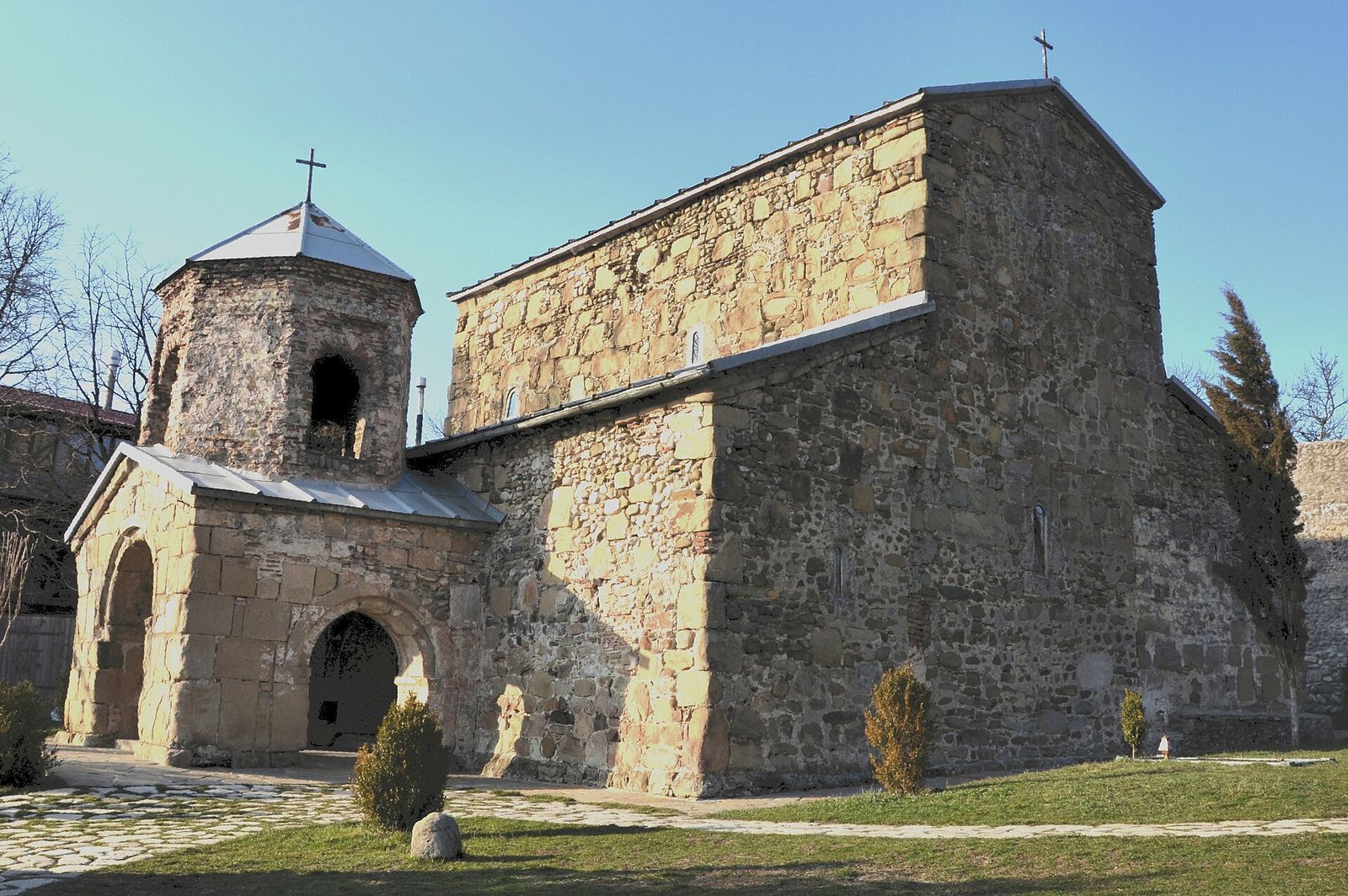 The stone church and bell tower of Zedazeni Monastery in the forest above Mtskheta