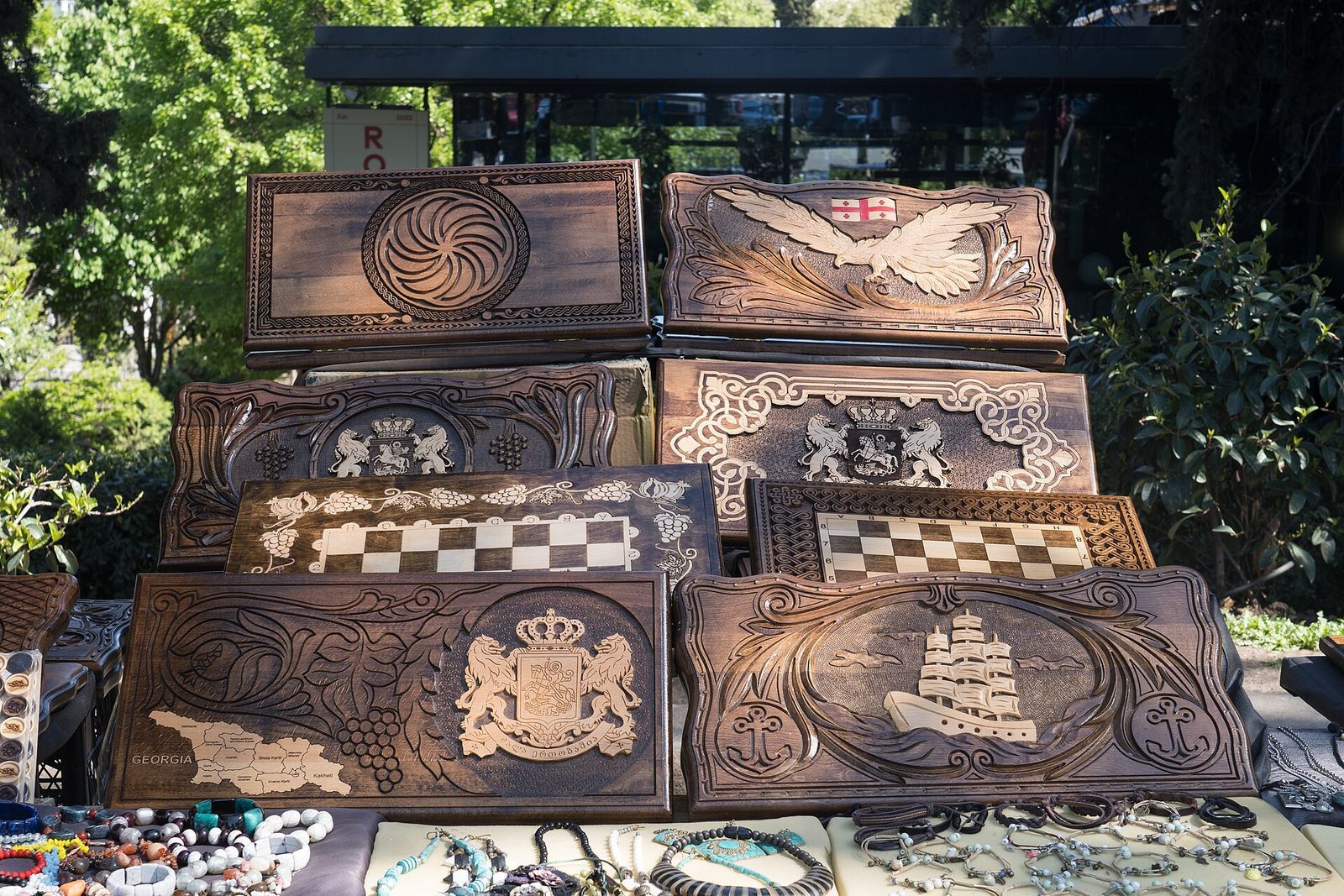 Carved and painted wooden backgammon boards for sale at a souvenir stall in the Dry Bridge Market park
