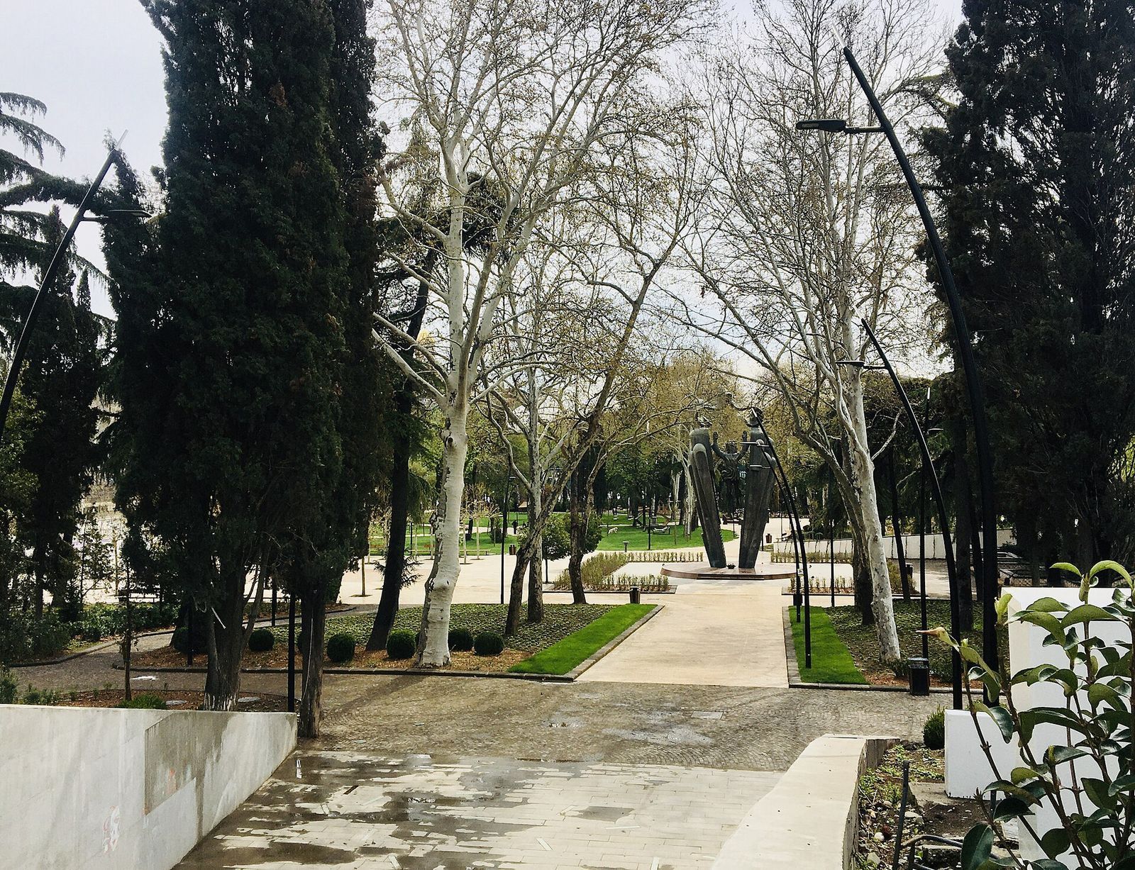 The renovated Dedaena Park in Tbilisi, with plane trees, new lawns and the Deda Ena monument at the end of the main path