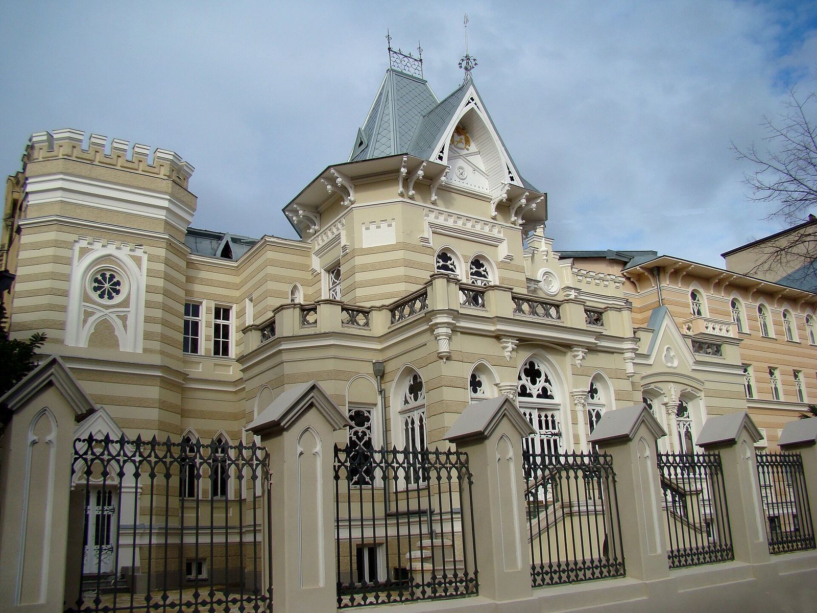 The Art Palace in Tbilisi, a turreted 19th-century mansion behind an iron fence, home to the museum of theater, music and film