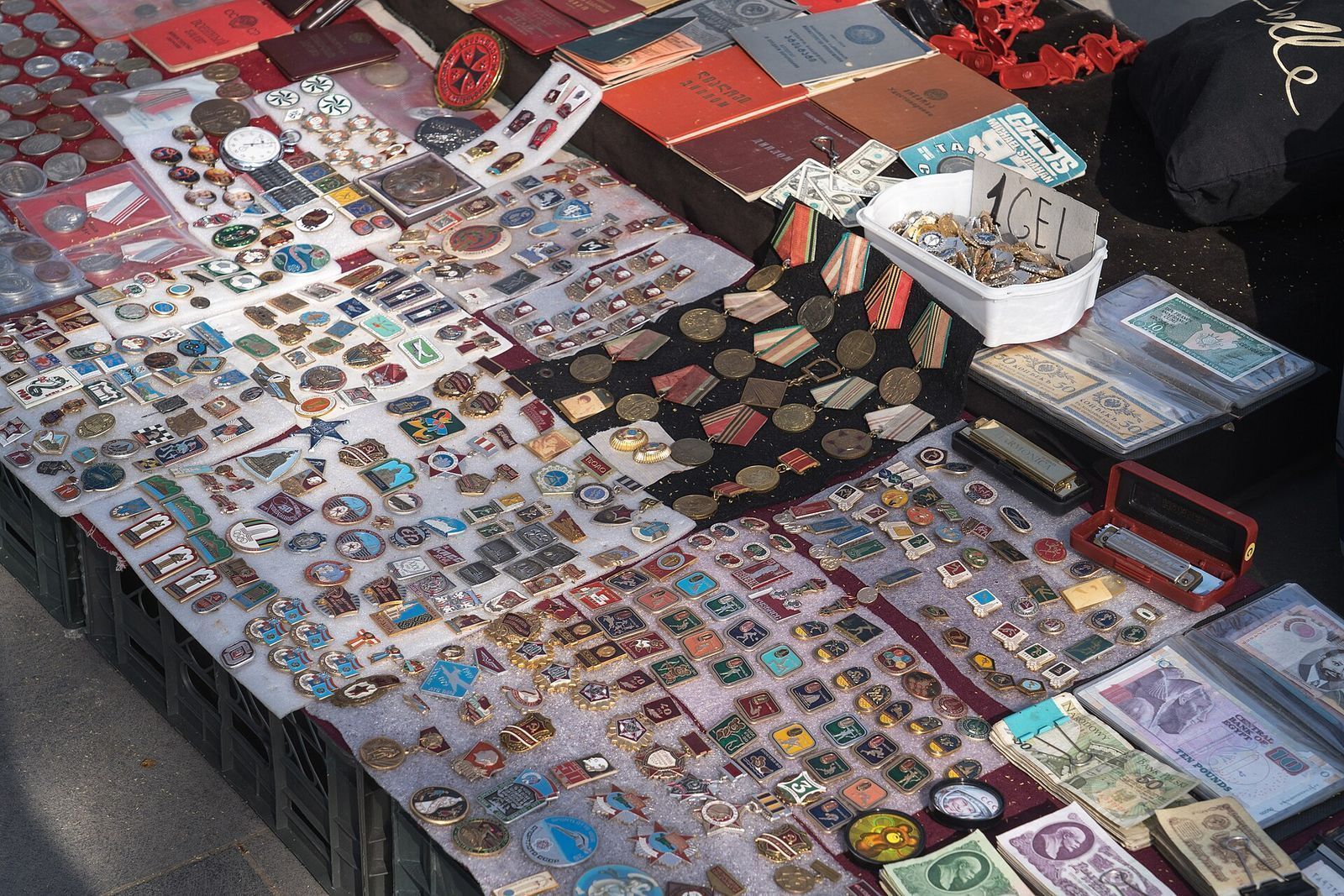 Soviet badges, medals and old banknotes laid out on a stall at the Dry Bridge market in Tbilisi