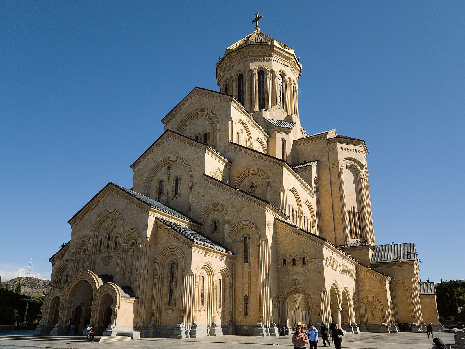 Holy Trinity Cathedral (Sameba) in Tbilisi, its gold-topped dome against a blue sky
