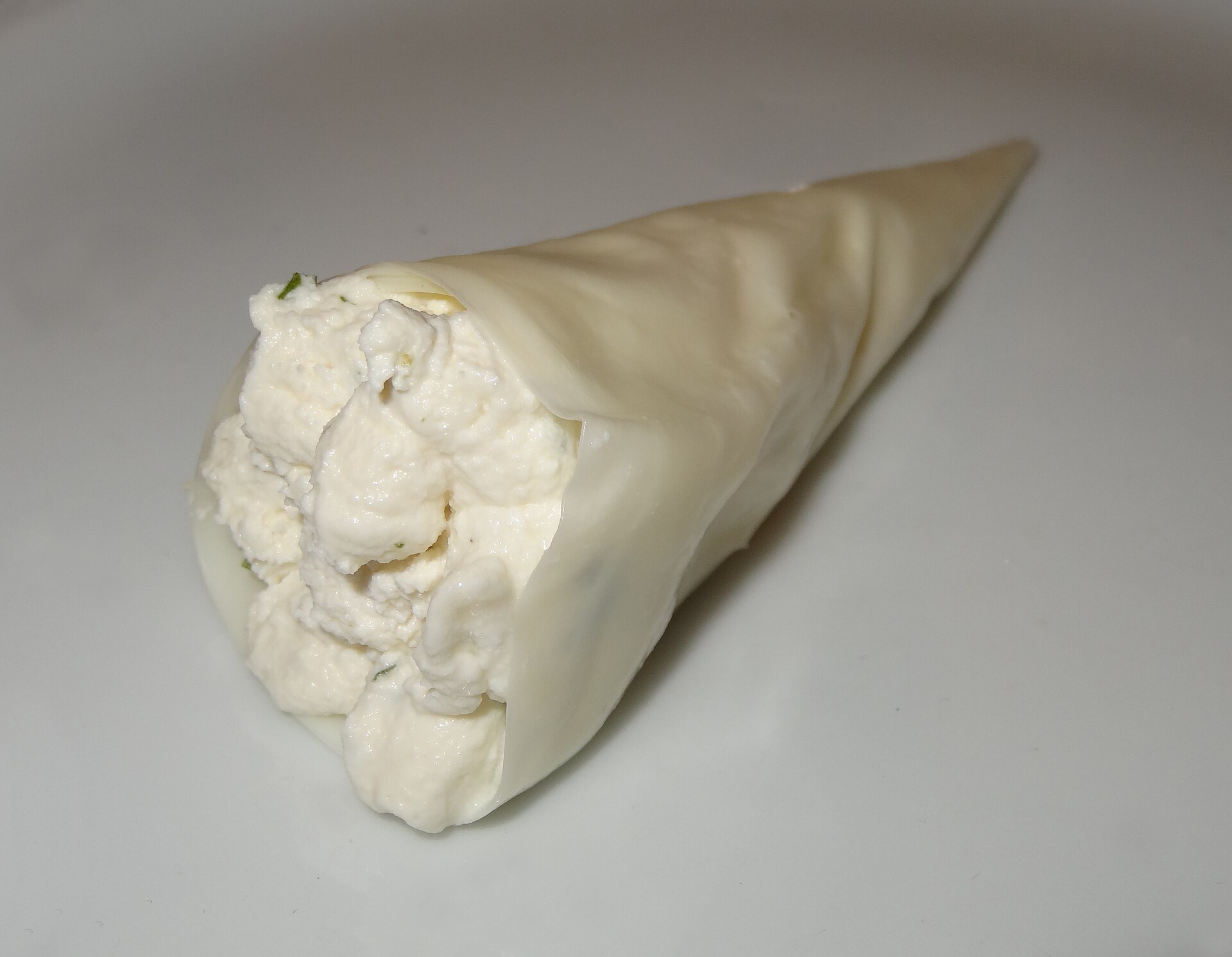 Soft white nadughi whey cheese rolled inside a thin sheet of sulguni