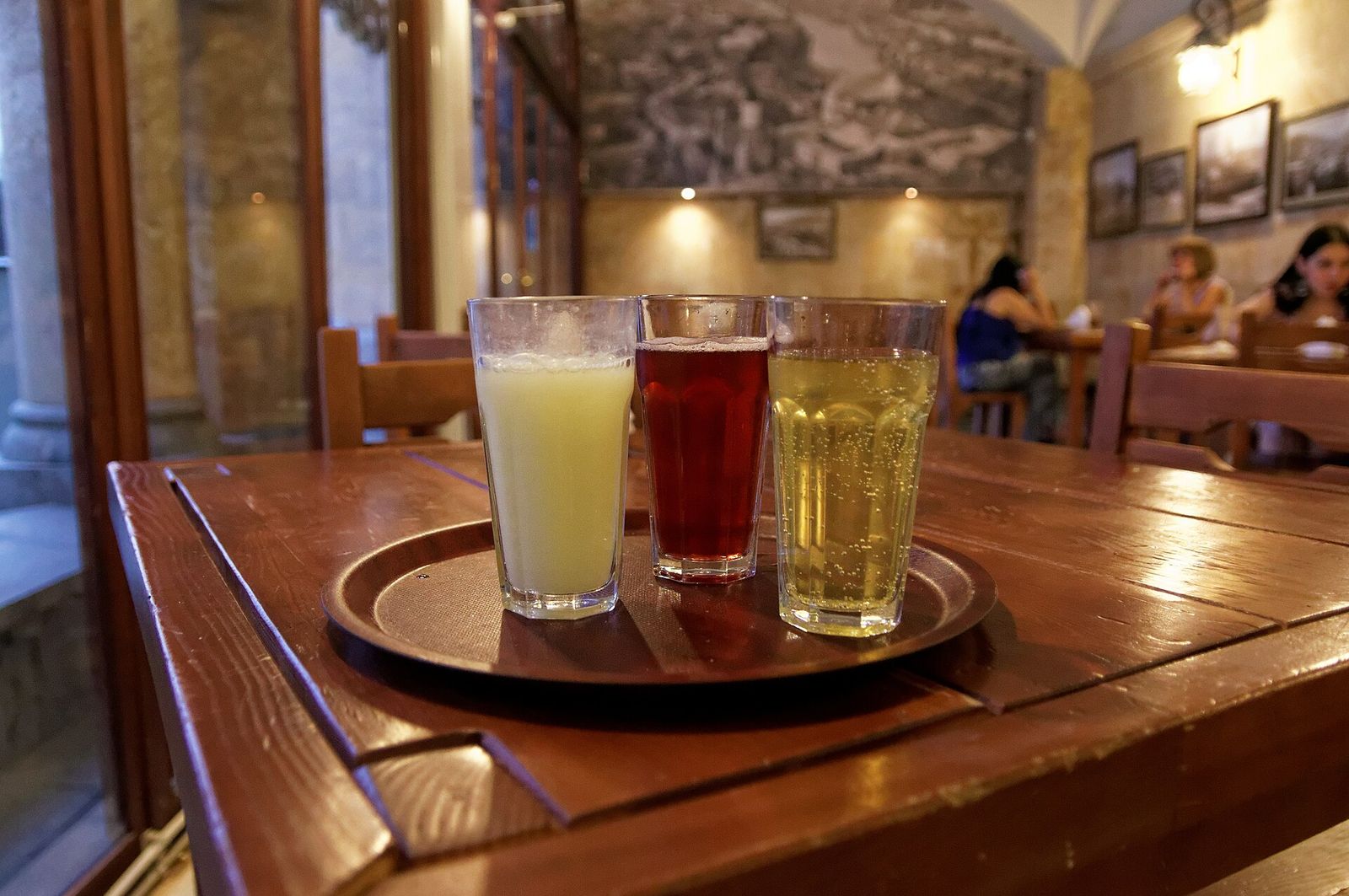 Three glasses of Lagidze water on a tray in a Tbilisi cafe