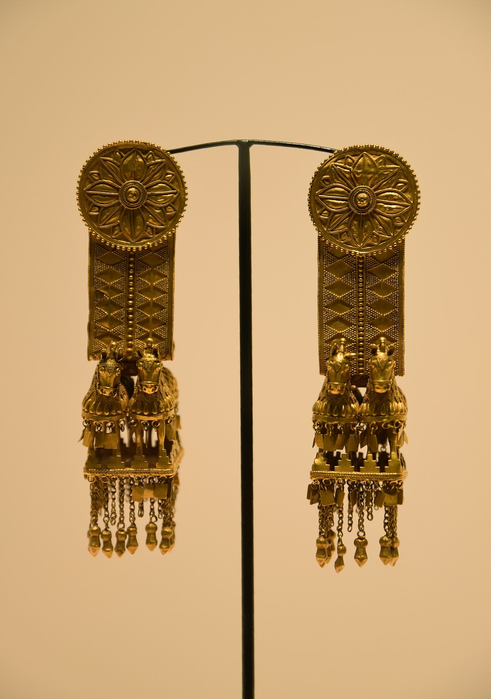 Gold temple rings with tiny horse pendants from the Akhalgori hoard, 4th century BC, in the Georgian National Museum in Tbilisi