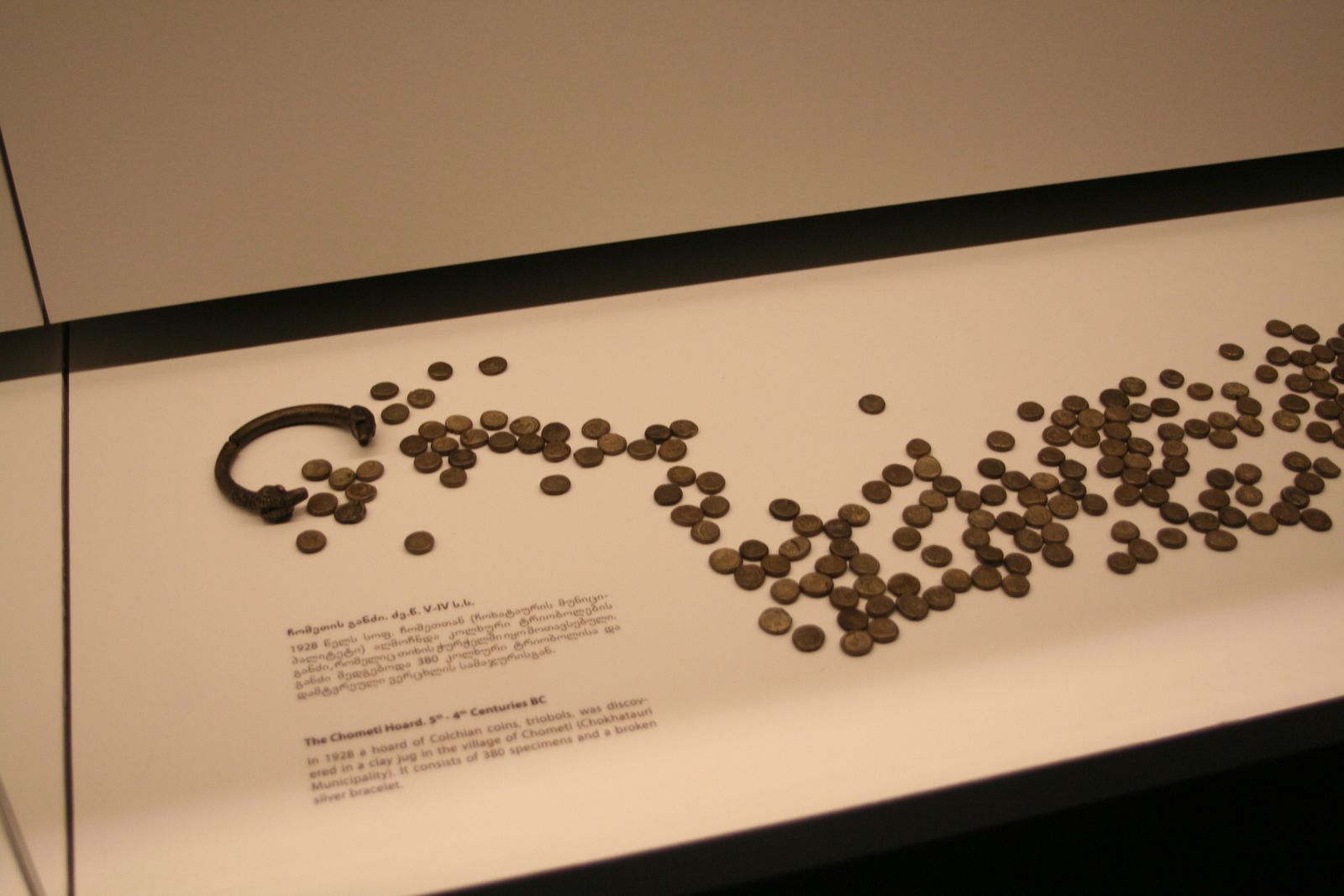 The Chometi hoard of Colchian silver coins and a broken silver bracelet in a case in the Numismatic Treasury of the Georgian National Museum