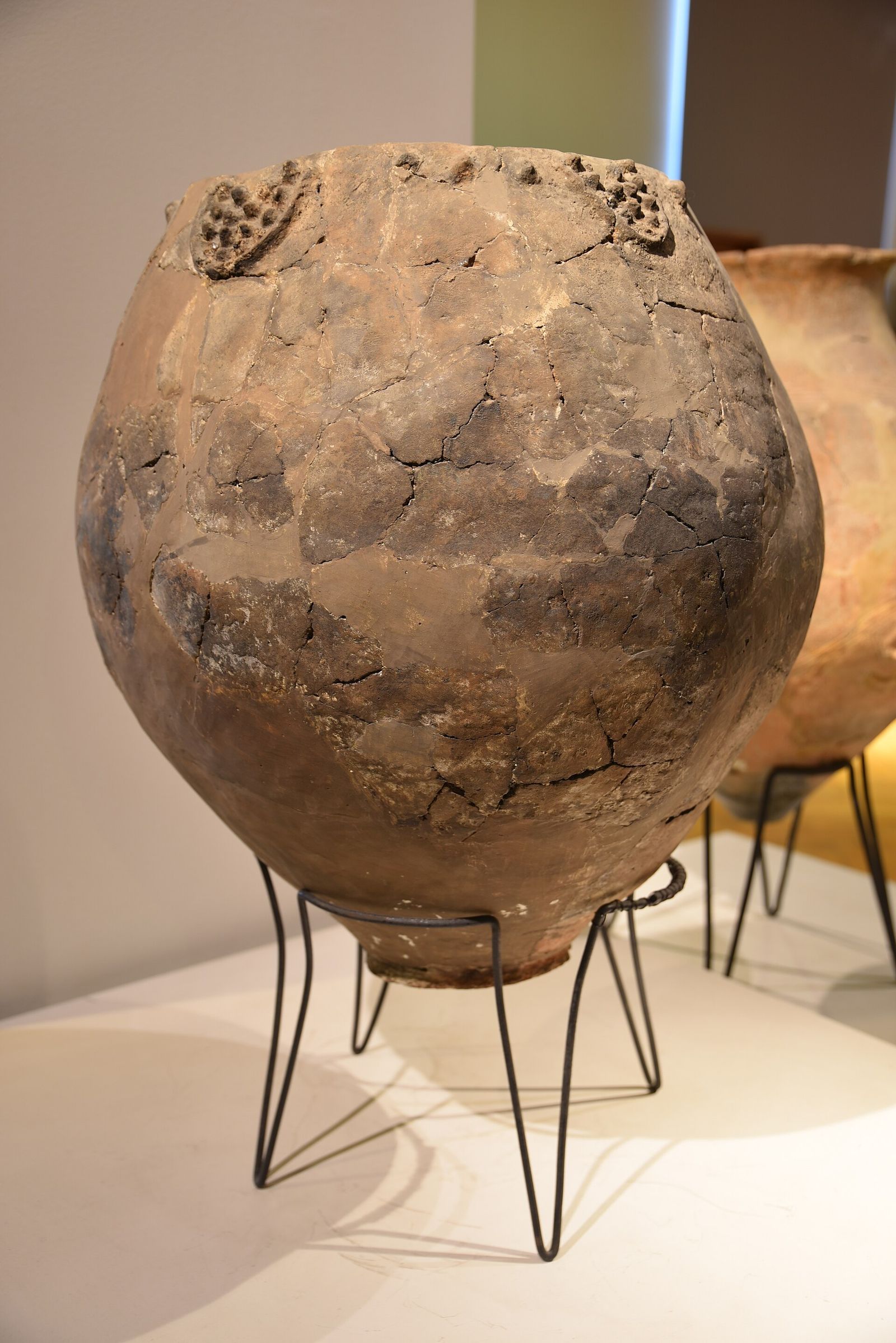 A Neolithic clay qvevri decorated with molded grape bunches, from the first half of the 6th millennium BC, on display at the Georgian National Museum in Tbilisi