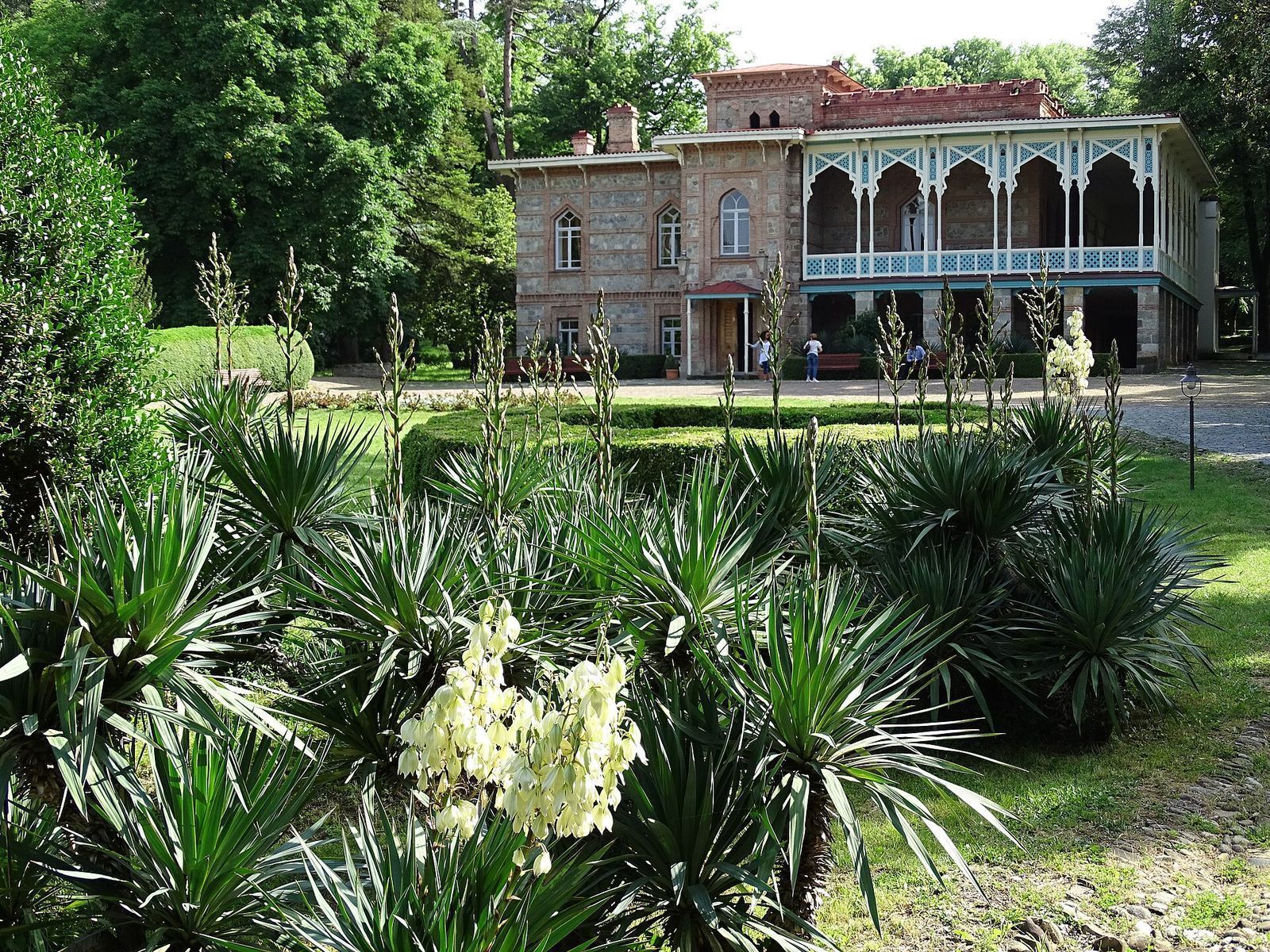 The Chavchavadze family mansion at Tsinandali Estate in Kakheti, with its arched wooden balcony behind the gardens