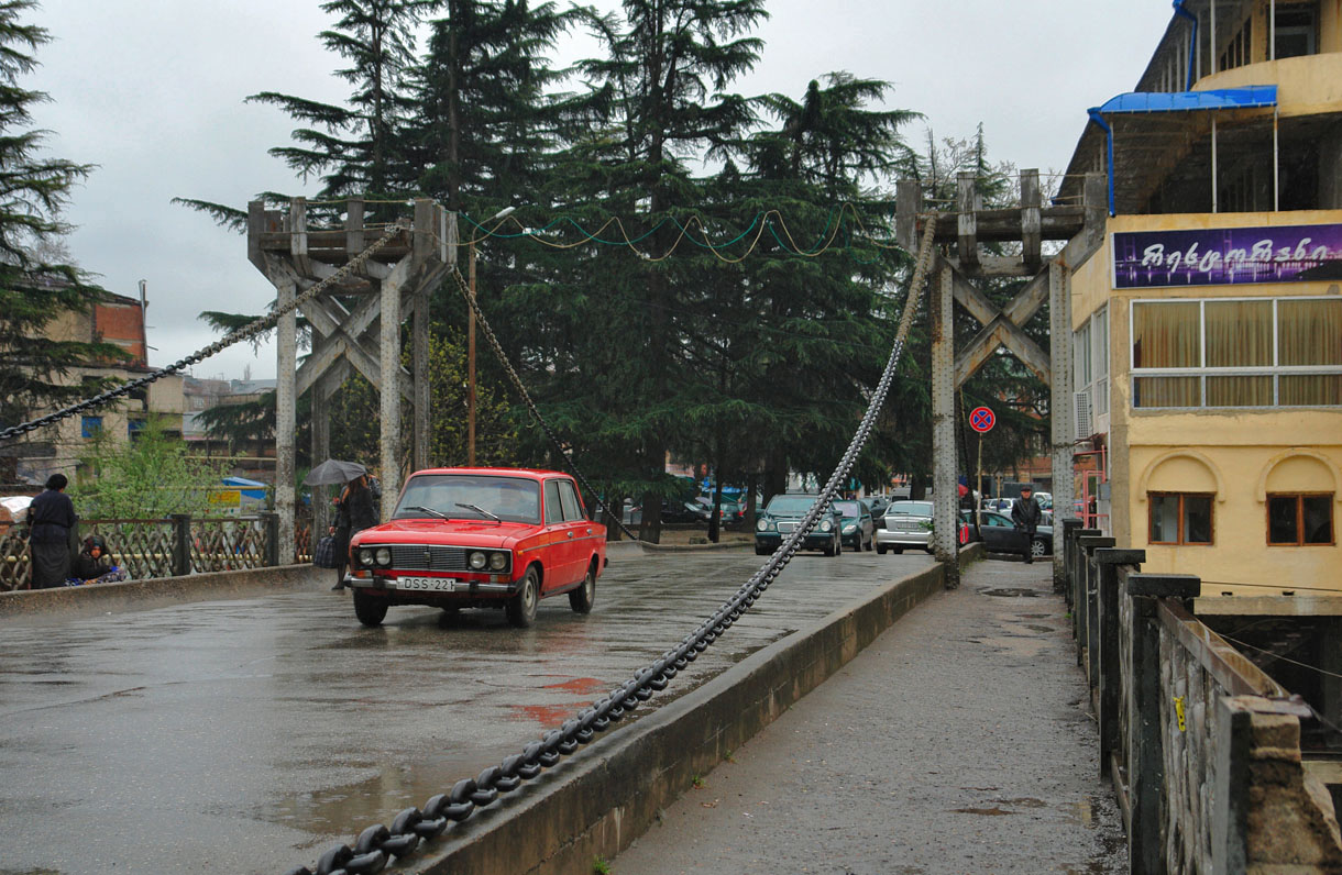 The Chain Bridge in Kutaisi, with heavy iron chains hung between two steel towers over the roadway