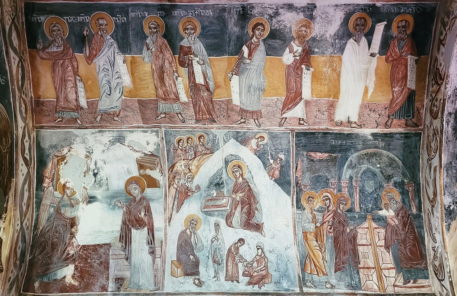 Painted frescoes of saints and Bible scenes on the walls inside the main church at Gelati Monastery