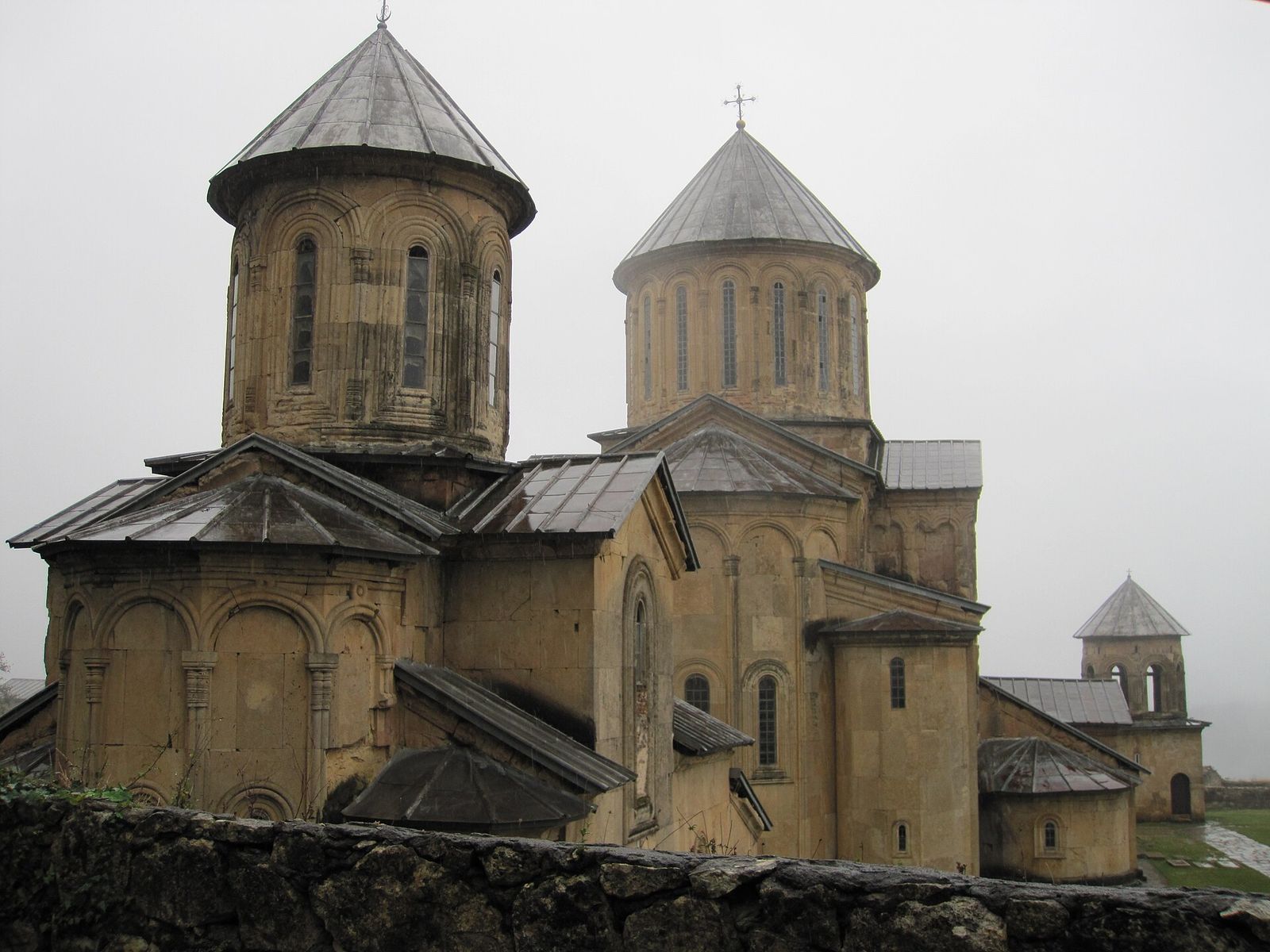 The domed stone churches of Gelati Monastery near Kutaisi on a misty day