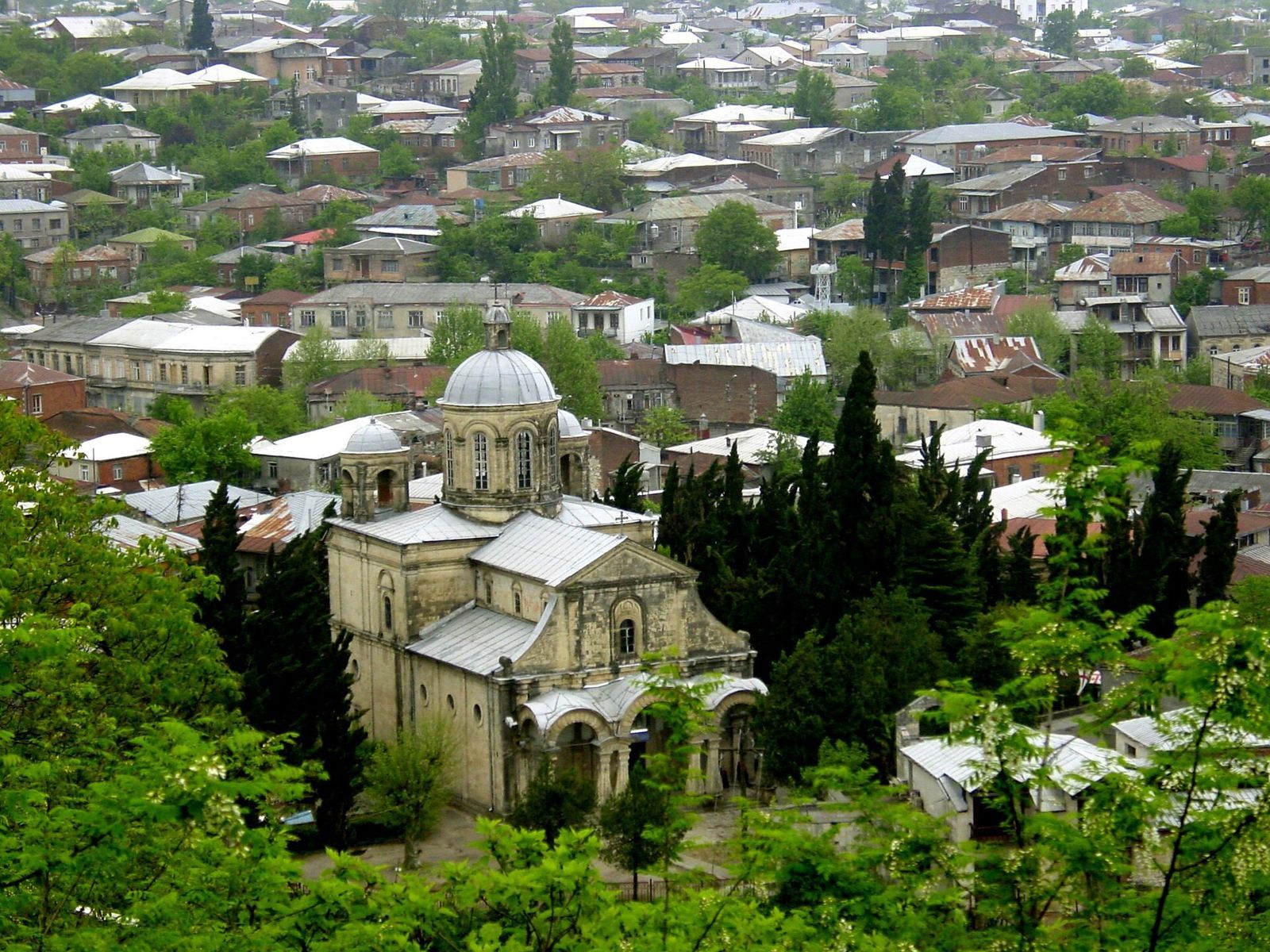 The domed Khareba (Annunciation) church among the low houses and gardens of Kutaisi's French Quarter