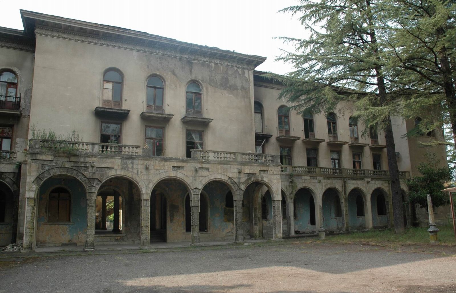 The faded Imereti sanatorium in Tskaltubo, a Soviet spa building with arched colonnades on its ground floor