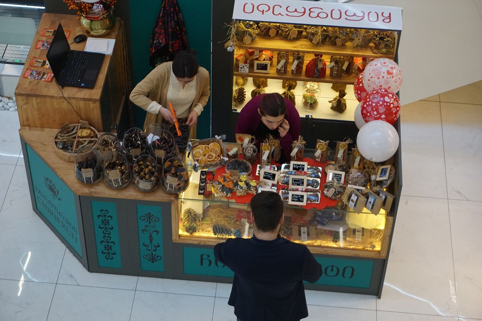 A kiosk selling Georgian dried fruit and sweets in gift boxes inside Galleria Tbilisi