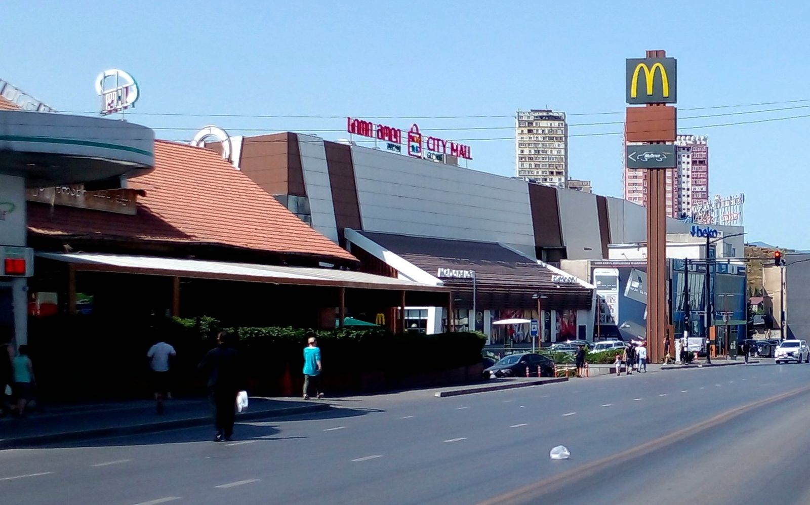 The City Mall Gldani building on Ilia Vekua Street, its City Mall sign on the roof behind a McDonald's