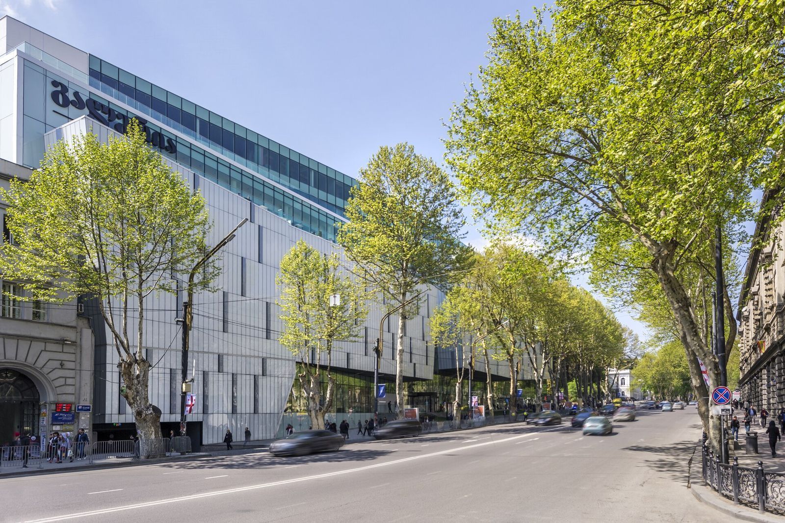 The Galleria Tbilisi shopping mall on Rustaveli Avenue, behind a row of plane trees