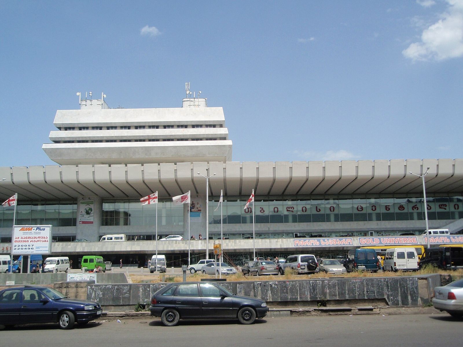 The Tbilisi Central building on Station Square, its name spelled across the glass front of the railway station
