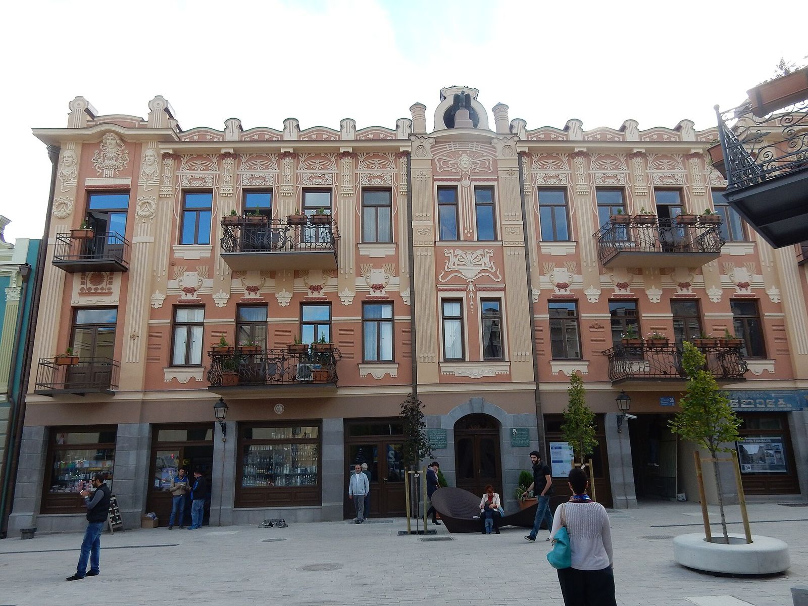 The pink Art Nouveau facade of Chavchanidze House, the Eagle House, on Aghmashenebeli Avenue in Tbilisi, with an eagle sculpture on its roofline