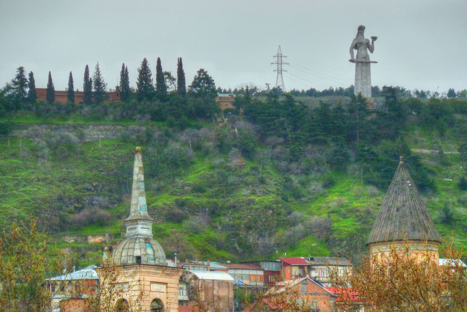 The Mother of Georgia statue on the ridge above the Old Town, holding a bowl in one hand and a sword in the other