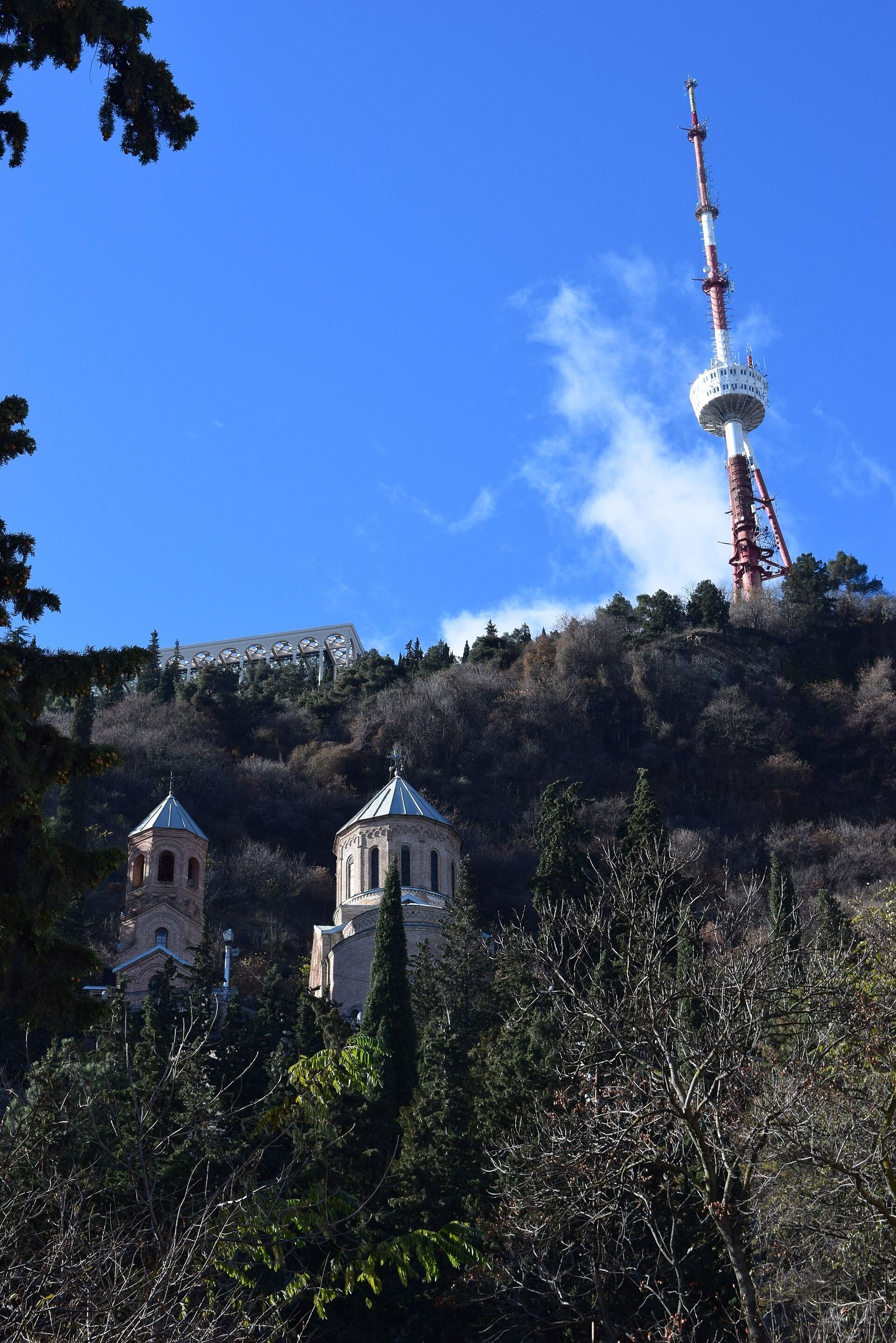Mama Daviti Church at the Mtatsminda Pantheon, with the TV tower on the ridge above
