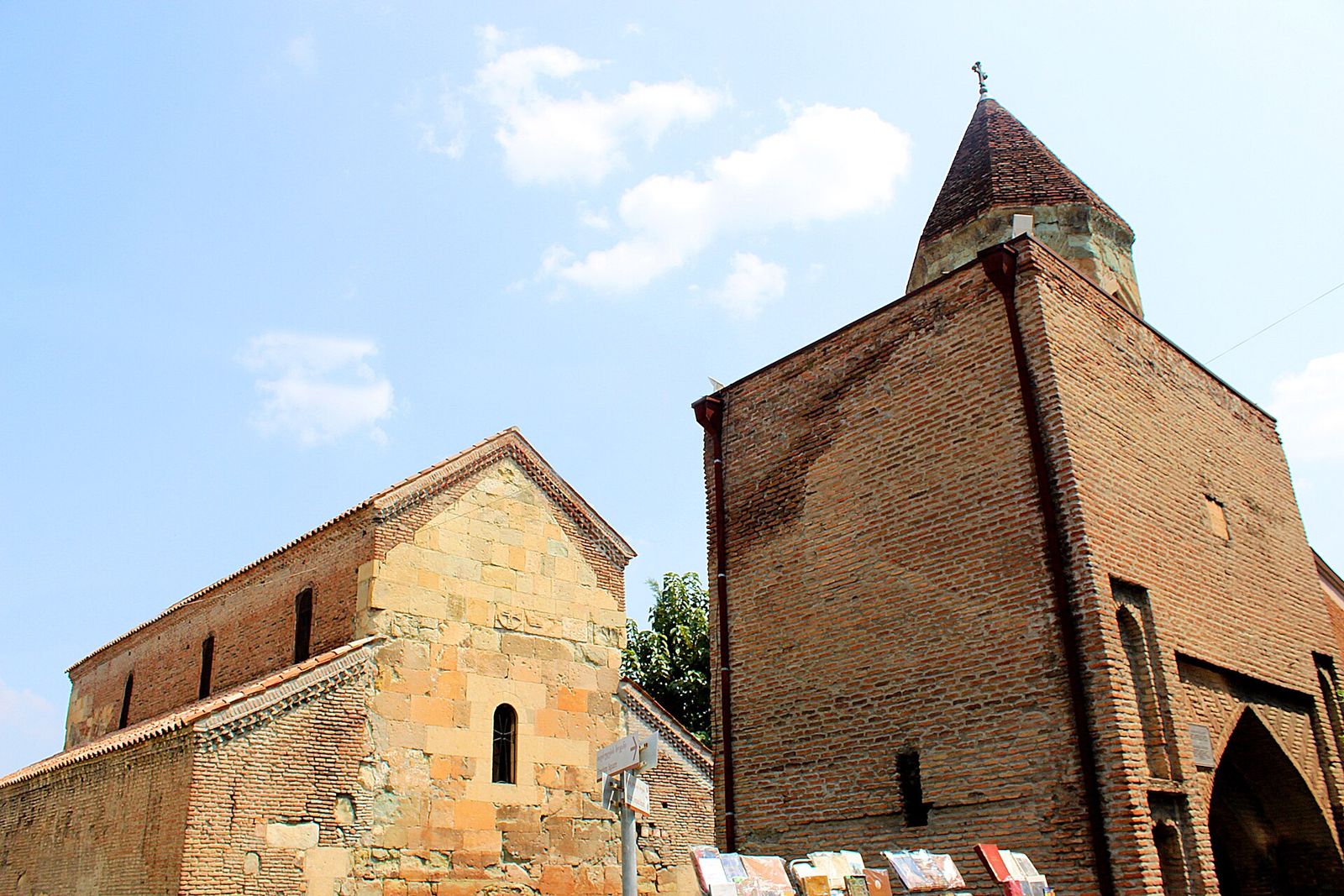 Anchiskhati Basilica, the oldest church in Tbilisi, with its stone nave beside the brick bell tower in the Old Town