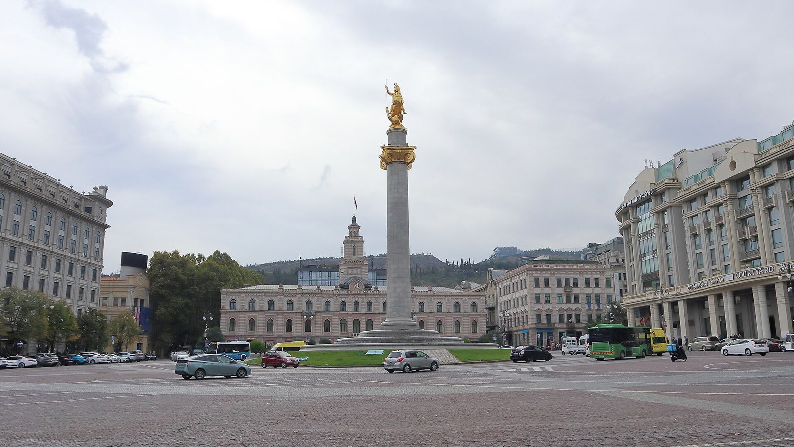 Freedom Square in Tbilisi with the gilded St George statue on its tall column, City Hall behind it and the Courtyard Marriott on the right