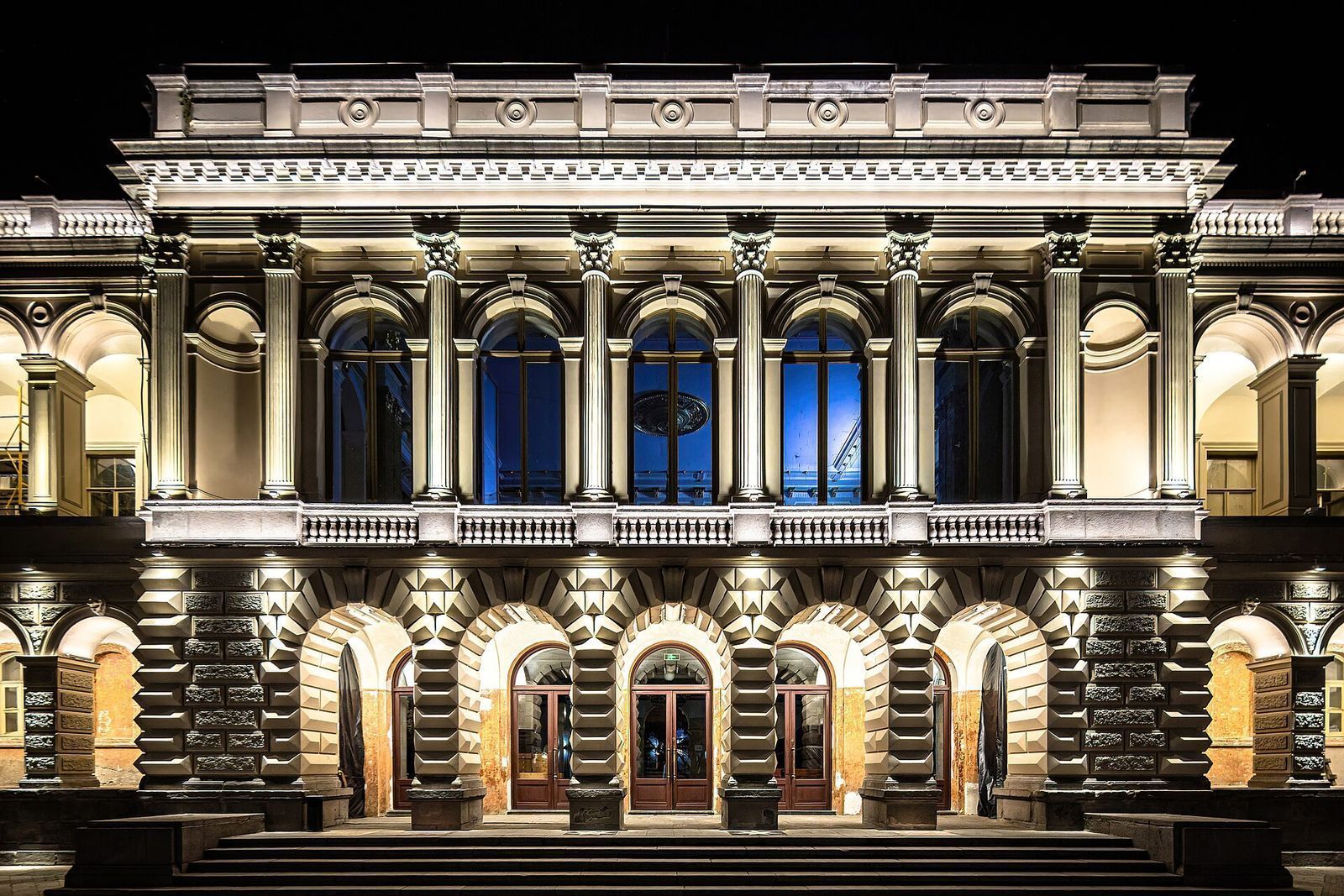 The floodlit arcaded front of the Youth Palace, the former Vorontsov Palace, on Rustaveli Avenue at night