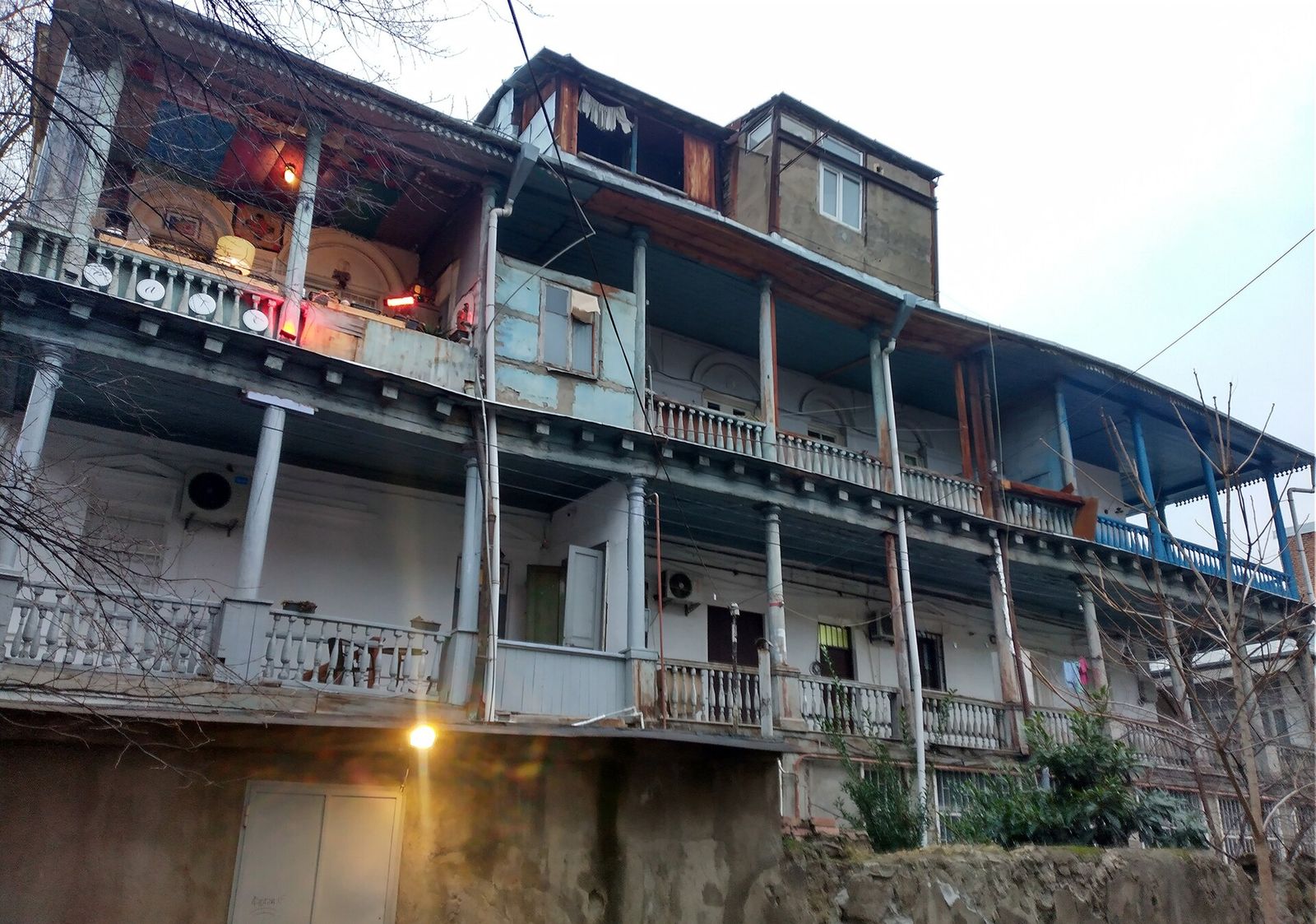 Wooden galleries with railings and balconies on the courtyard side of a house at 1 Giga Lortkipanidze Street in Sololaki