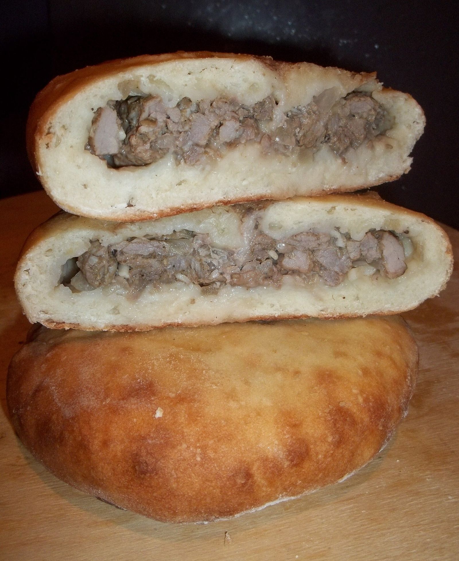 Kubdari, the Svan meat bread, cut open to show the chopped meat filling