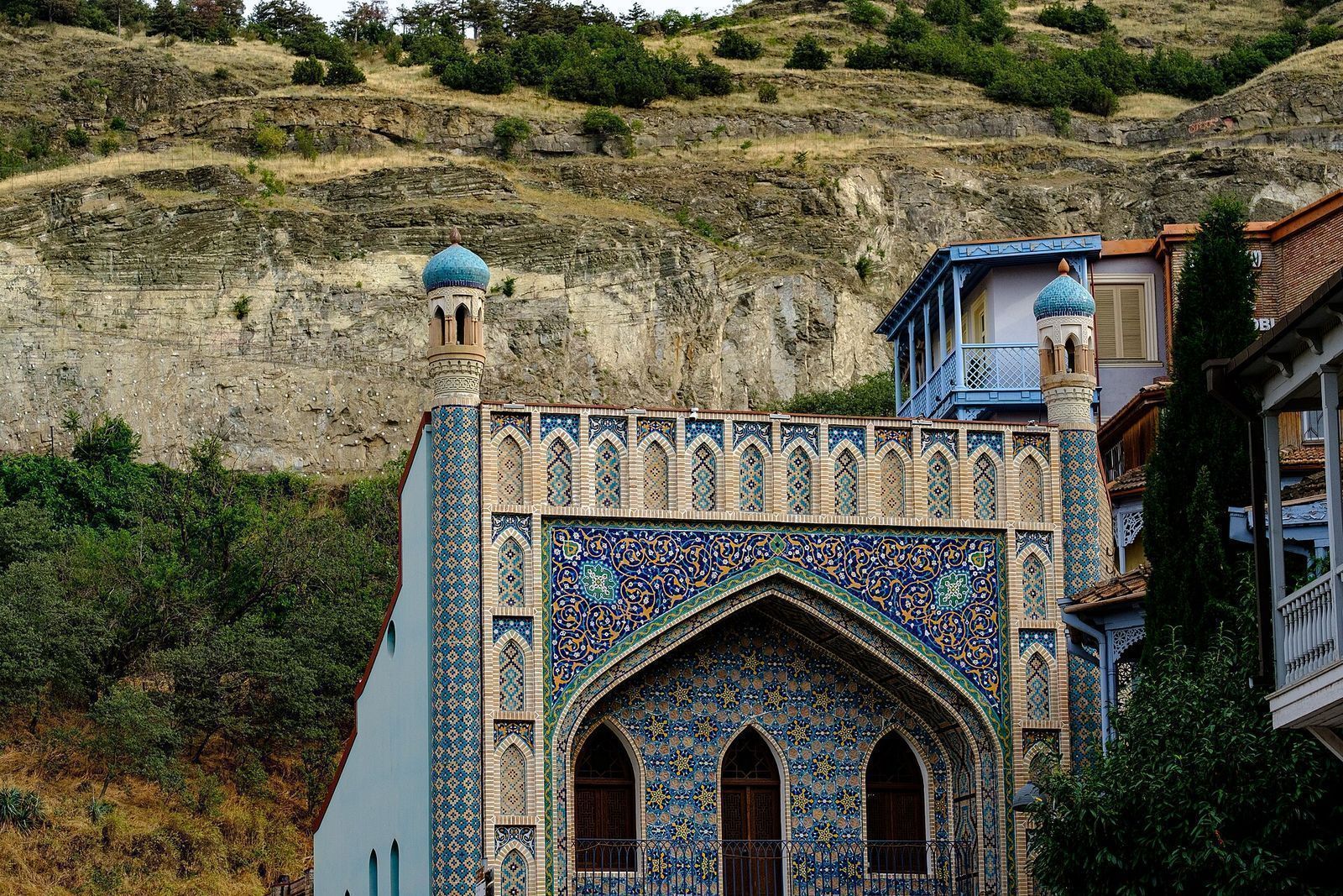 The blue tiled facade of Chreli Abano, the Orbeliani bathhouse, with its two turquoise-capped towers