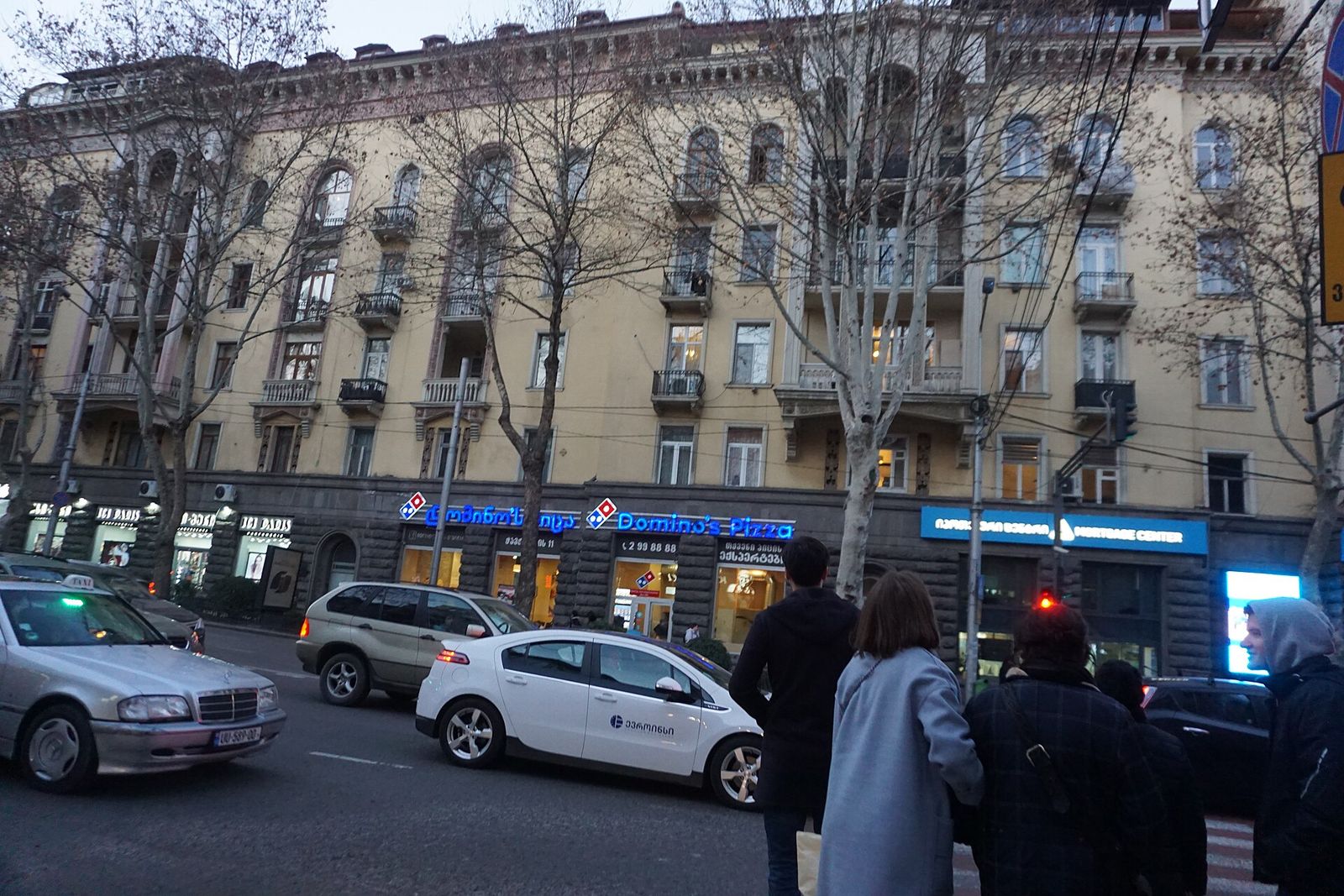 A street taxi with a roof sign driving along Ilia Chavchavadze Avenue in Tbilisi
