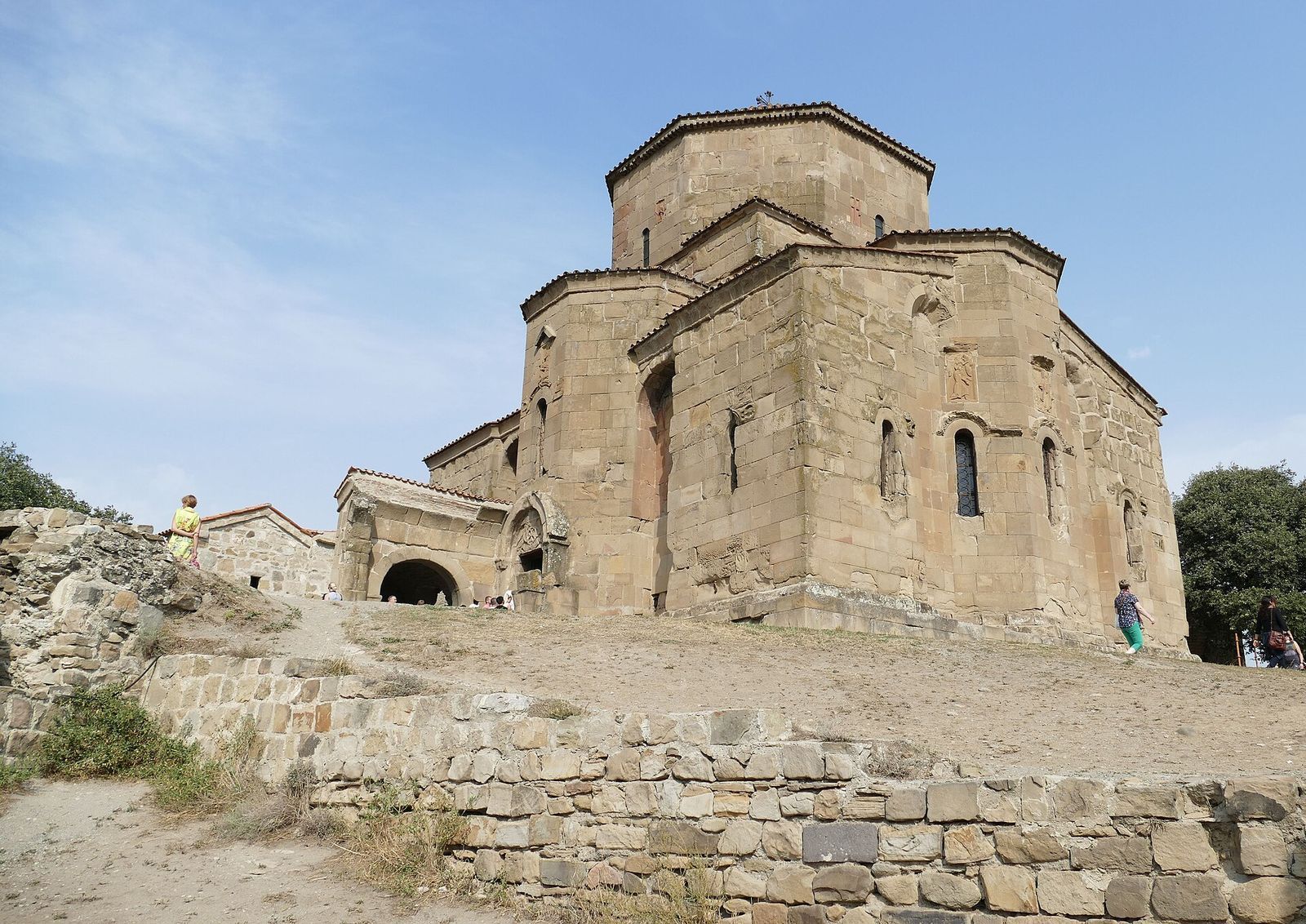 The 6th-century stone church of Jvari Monastery with its octagonal drum, seen from the path up its hilltop above Mtskheta