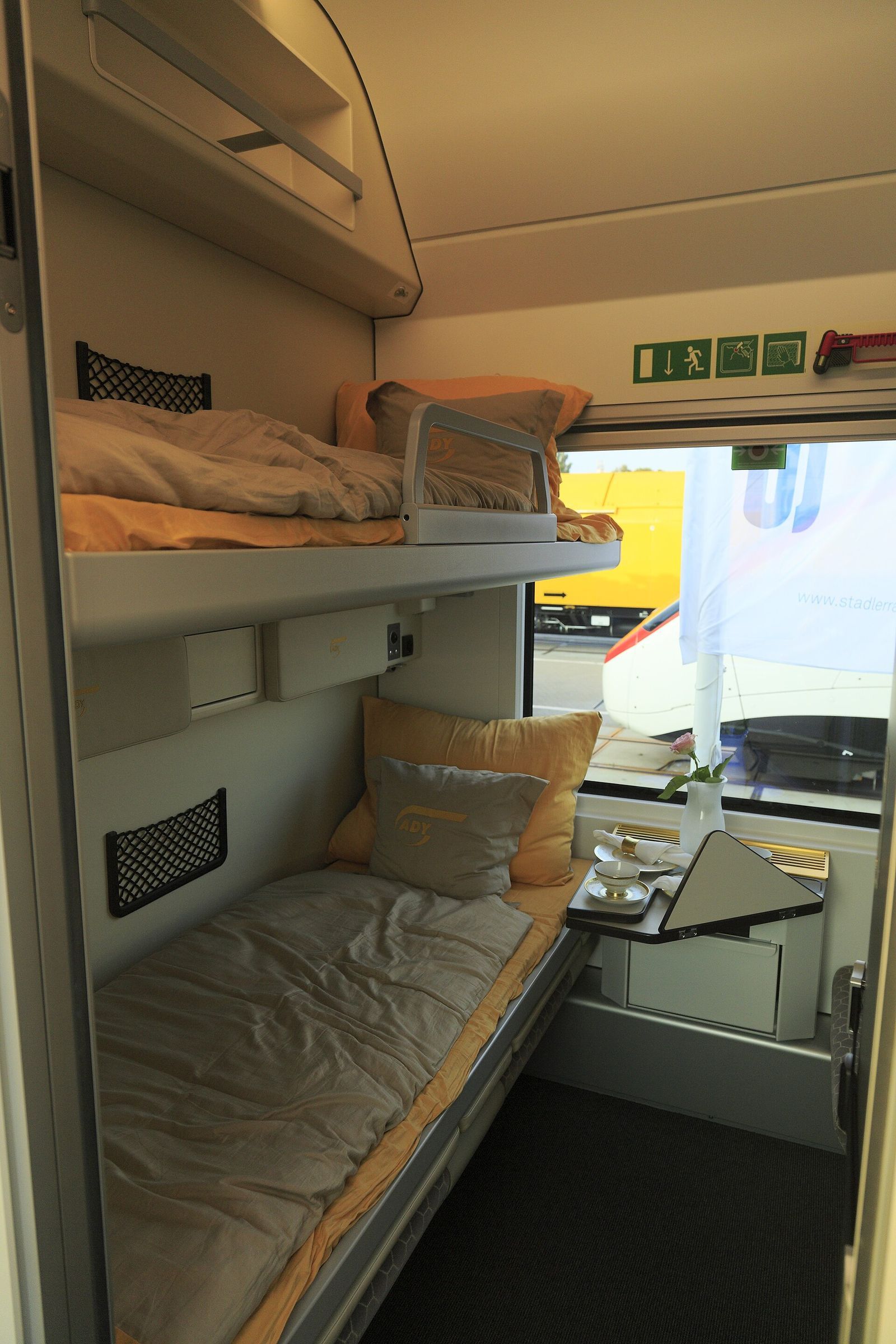 Inside a two-berth compartment of an Azerbaijan Railways Stadler sleeping car, with the bunks made up for the night