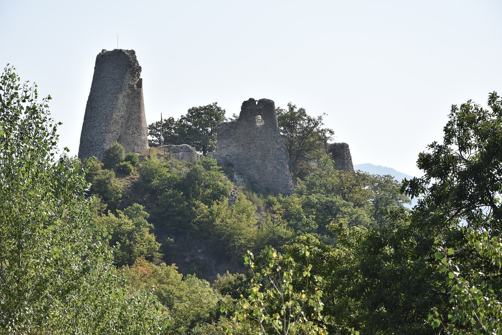 The ruined towers of Ujarma Fortress rising above the forest on the road from Tbilisi to Telavi