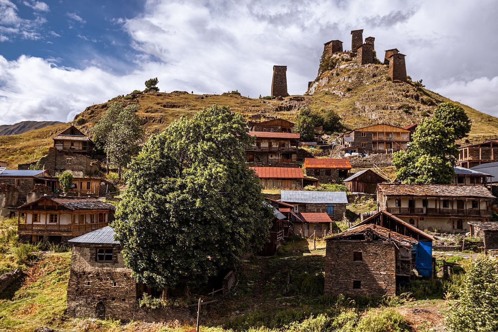 Stone towers on the hill above the houses of Omalo, a mountain village in Tusheti